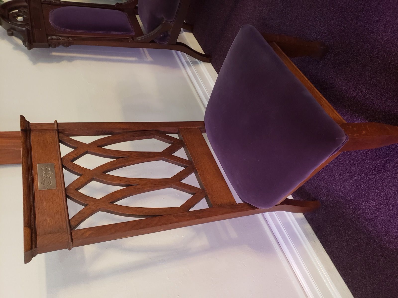 A photo of chancel chair in our sanctuary, made of wood from the Strawbridge oak tree.